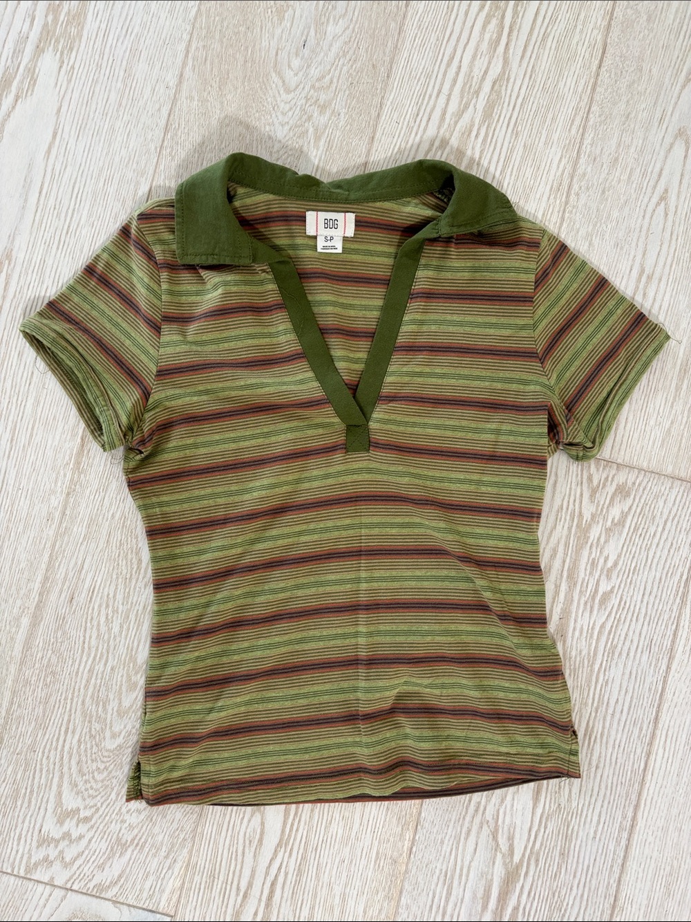 Women’s size small BDG polo.